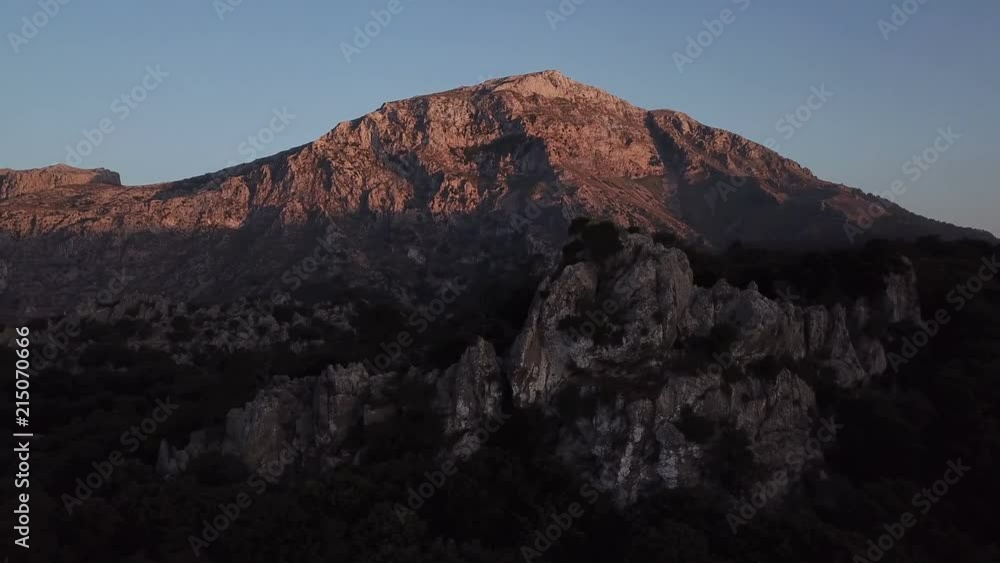 Mountain glowing with sunlight at sunset Mountain glowing with sunlight at sunset