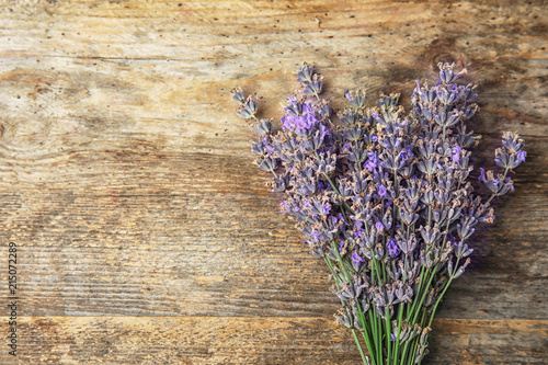 Fototapeta Naklejka Na Ścianę i Meble -  Lavender flowers on wooden background, top view