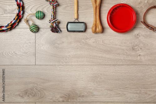 Fototapeta Naklejka Na Ścianę i Meble -  Flat lay composition with accessories for dog and cat on wooden background. Pet care