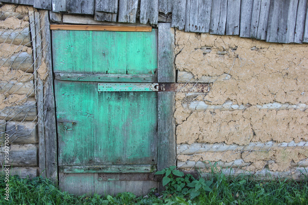Locked green door in a country house Locked green door in a country house