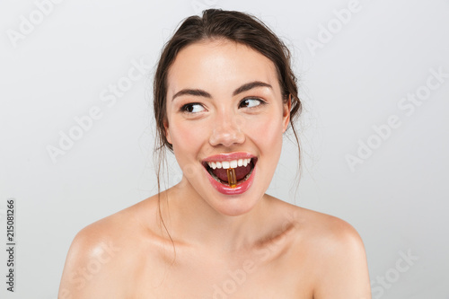 Beauty portrait of a cheerful young topless woman