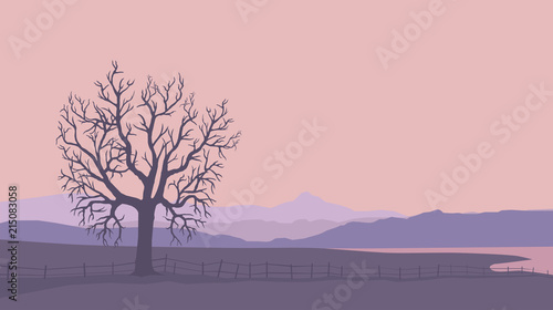 Mountain landscape with tree, fence and huge lake.