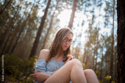 Girl sitting in a wood