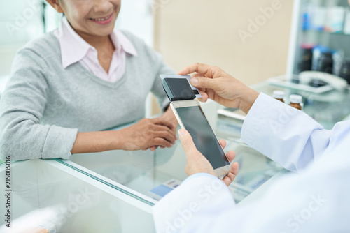 Pharmacist with card reader