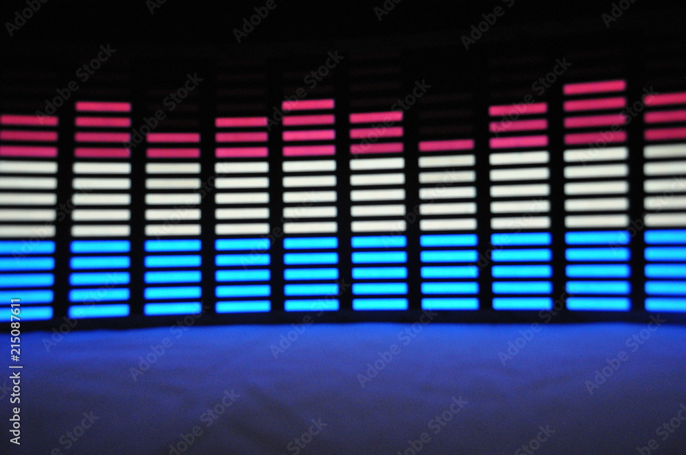 Light panel of pixels, neon with blue or green, yellow and red, a bright equalizer on a white background