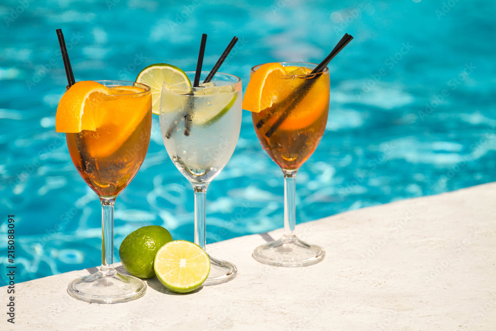 Tropical cocktail on a pool background