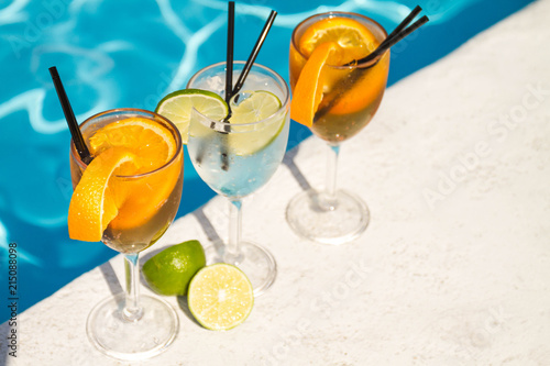 Tropical cocktail on a pool background