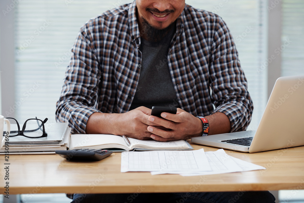 Businesman checking text messages Businesman checking text messages