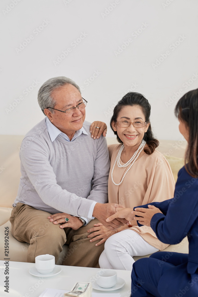 Aged couple meeting with financial adviser Aged couple meeting with financial adviser