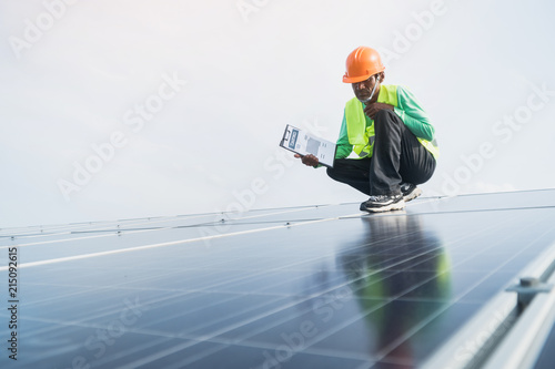 engineer working on maintenance panel in solar power plant