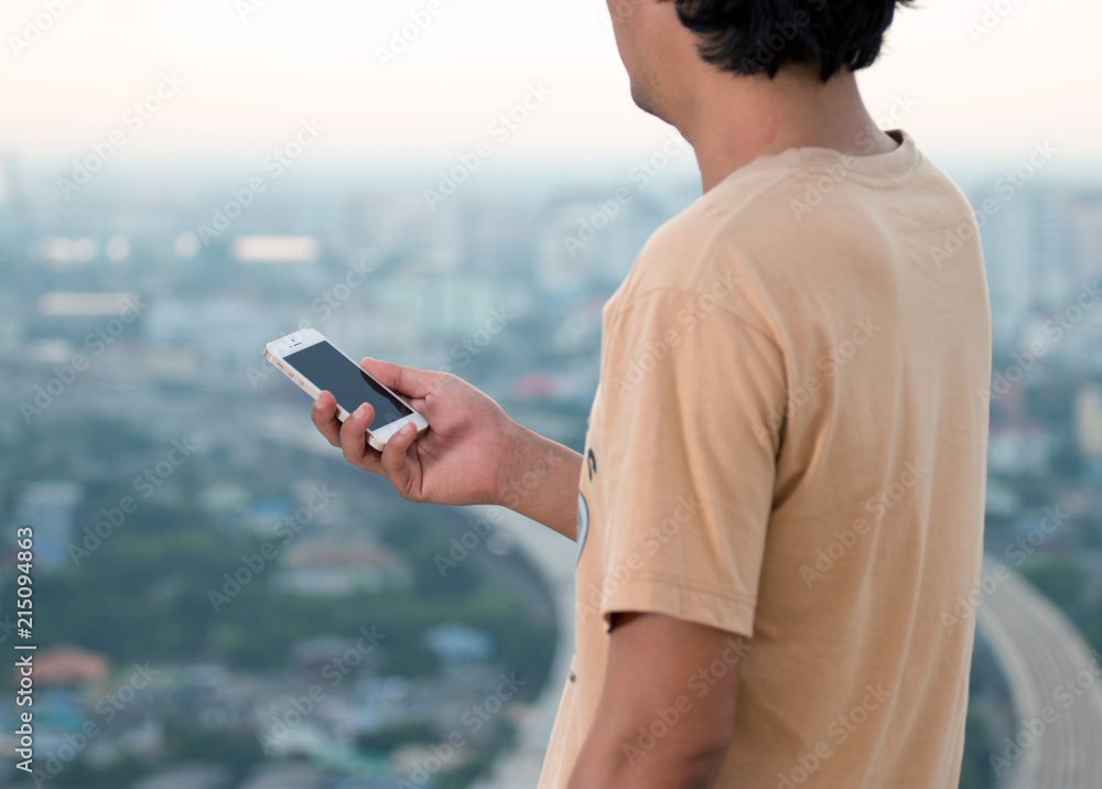 Close up of a man using mobile smart phone,travel people