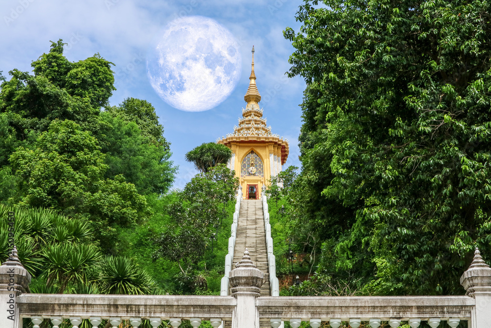 full moon back silhouette triple pagoda in sky
