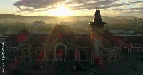 Aerial shot: Dawn over the railway station, dolly shot photo