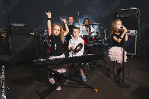 happy children singing and playing music