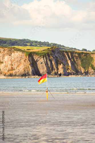 RNLI lifeguard flag on beach