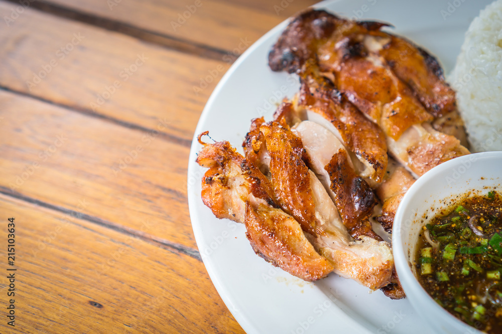 Grilled chicken cut into pieces on a white plate Grilled chicken cut into pieces on a white plate