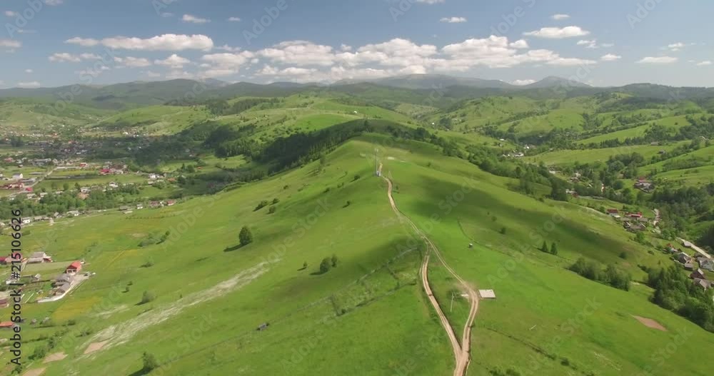 Beautiful aerial view of farmland hill landscape with terraced system and road in mountains.Drone view of high mountain ground wild road.Aerial road on a hill. Countryside hills stunning aerial view Beautiful aerial view of farmland hill landscape with terraced system and road in mountains.Drone view of high mountain ground wild road.Aerial road on a hill. Countryside hills stunning aerial view