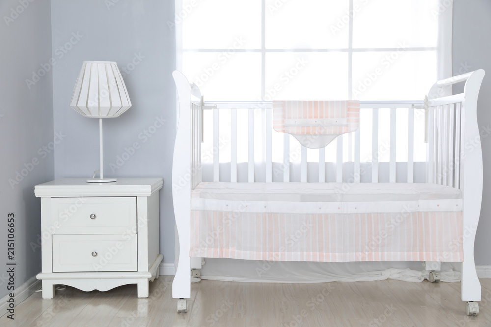 The image of child's bed under the white background The image of child's bed under the white background