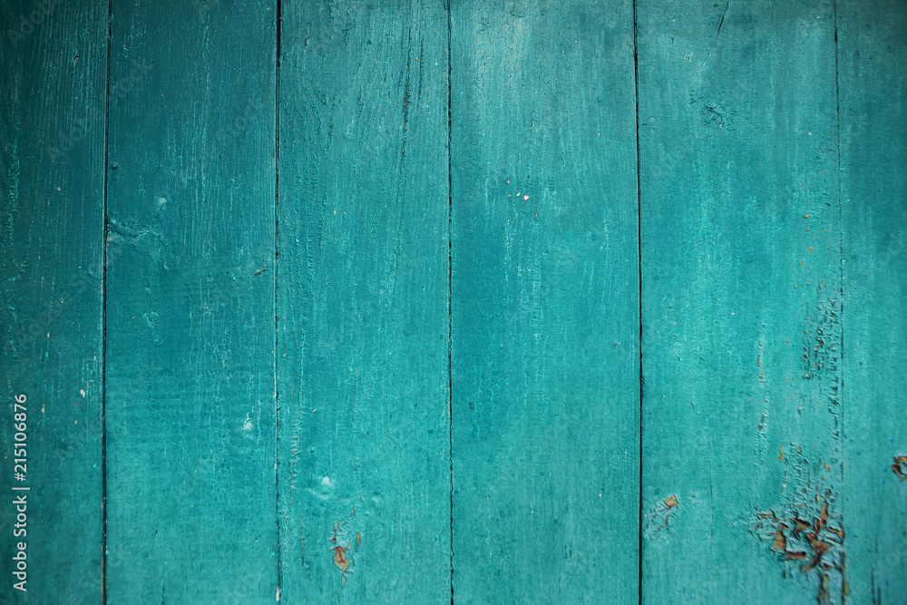 Shabby and very old wooden fence-color aquamarine. Shabby and very old wooden fence-color aquamarine.