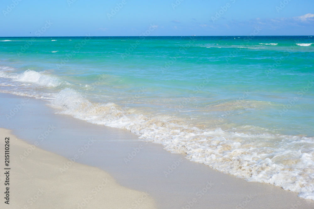 White sandy beach and azure sea.