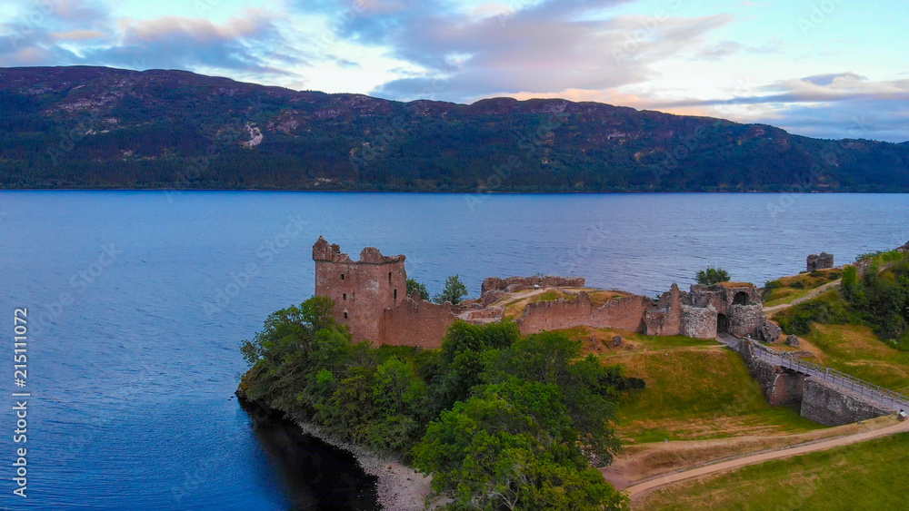 Loch Ness and Urquhart Castle in the evening - aerial view
