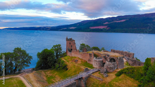 Fototapeta Naklejka Na Ścianę i Meble -  Loch Ness and Urquhart Castle in the evening - aerial view
