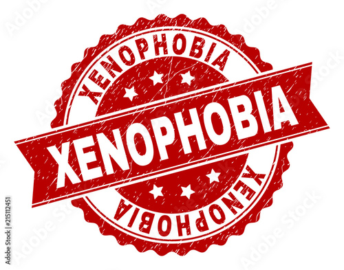 XENOPHOBIA seal watermark with corroded texture. Rubber seal imitation has round medal form and contains ribbon. Red vector rubber print of XENOPHOBIA label with corroded texture.