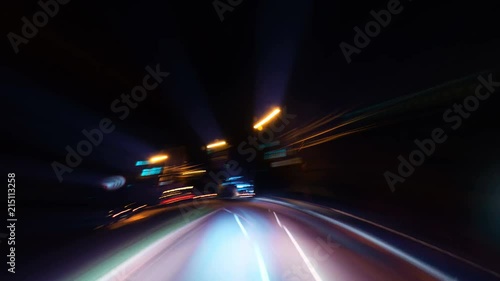 Night driving of a car in a metropolis through the streets and roads of the city