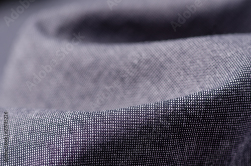 Gray fabric cloth macro clothing on blur background