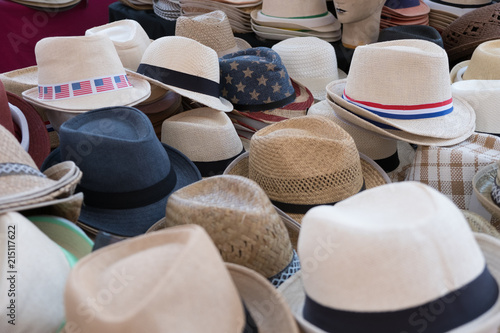 Straw hats for sale, on a market presented on a table