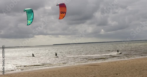 4 kitesurfers surfing the ocean in Denmark