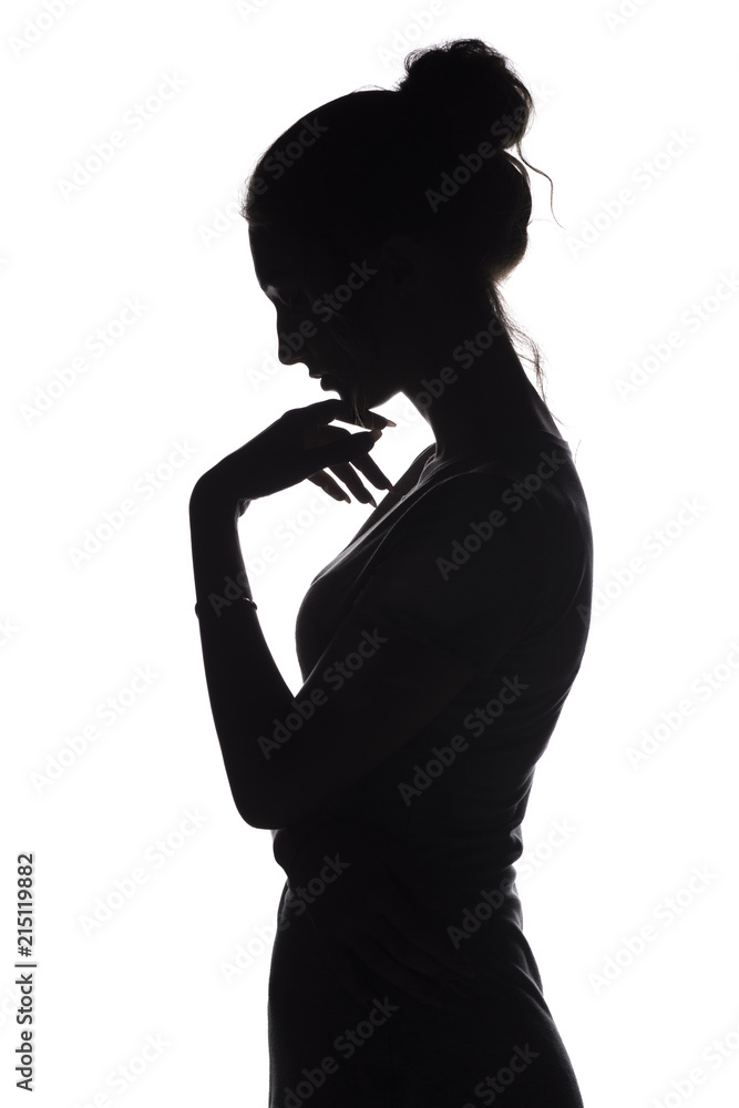 silhouette profile of a sad woman with hand near chin on a white isolated background