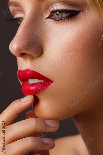Beautiful close-up portrait of fashion woman model with glamour classic makeup, red lipstick. Evening style, retro visage and manicure