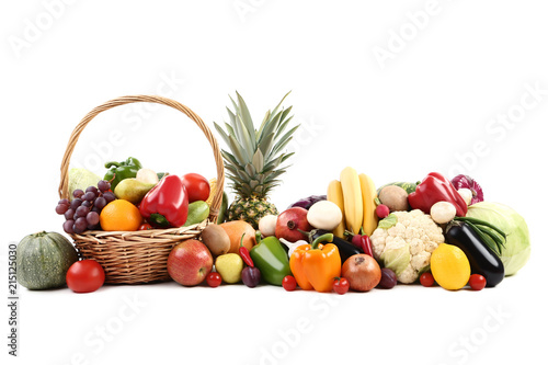 Ripe fruits and vegetables on white background