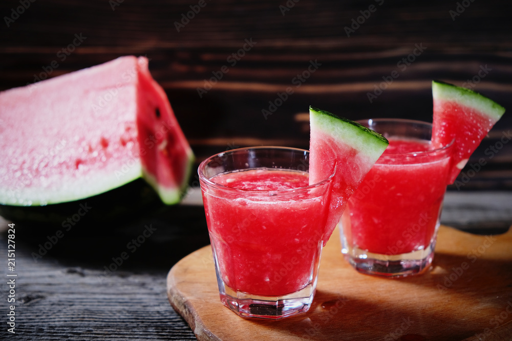 Watermelon cocktail on a wooden table. Watermelon cocktail on a wooden table.