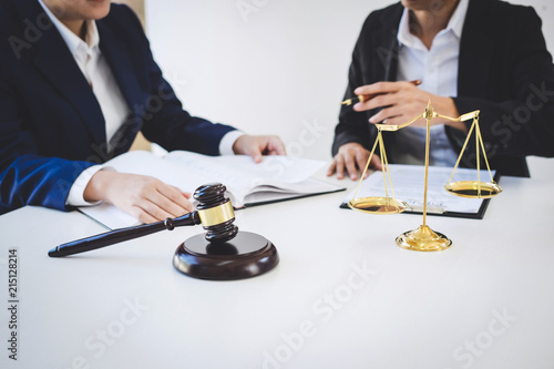 Teamwork of business lawyer colleagues, consultation and conference of professional female lawyers working having at law firm in office. Concepts of law, Judge gavel with scales of justice