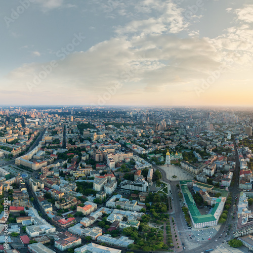 Panorama of the city of Kiev at sunset. A modern metropolis in the center of Europe against the backdrop of sunset sky from a bird's eye view. Aerial view. Panorama of the Tourist Center of Kiev. © LALSSTOCK