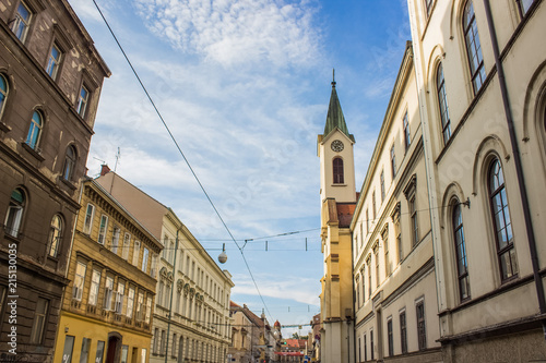 old city street with church tower