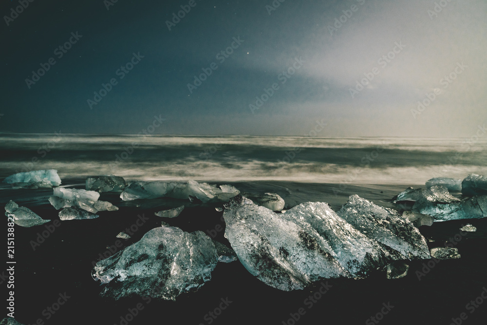 Night stars Ice rock with black sand beach at Jokulsarlon beach (Diamond beach) in southeast Iceland Night stars Ice rock with black sand beach at Jokulsarlon beach (Diamond beach) in southeast Iceland