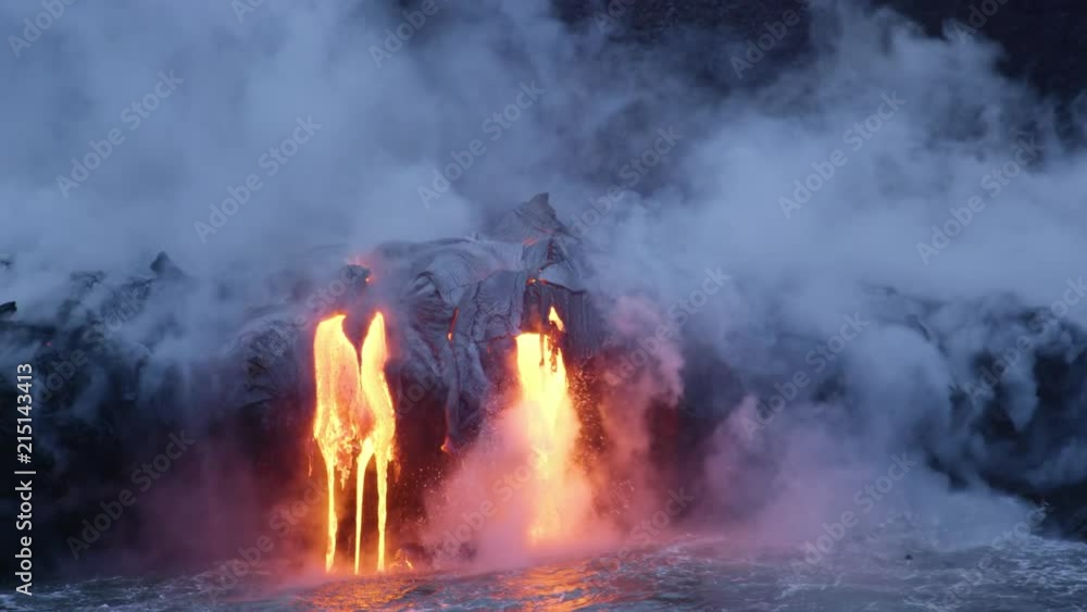 Molten Lava Streams from Hawaii's Kilauea Volcano Into the Ocean At Dawn Molten Lava Streams from Hawaii's Kilauea Volcano Into the Ocean At Dawn