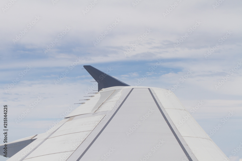 The wing of a flying plane The wing of a flying plane