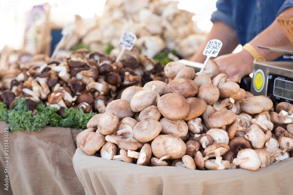Mushrooms piled up for sale at a farmers market Mushrooms piled up for sale at a farmers market