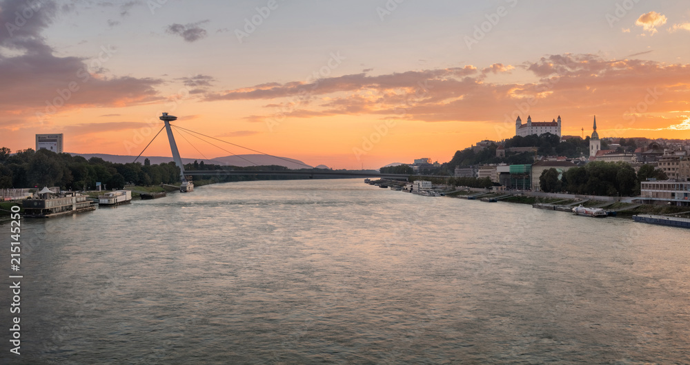 Panorama view on Bratislava castle and SNP Bridge (UFO) over the river Danube in Bratislava city, Slovakia Panorama view on Bratislava castle and SNP Bridge (UFO) over the river Danube in Bratislava city, Slovakia