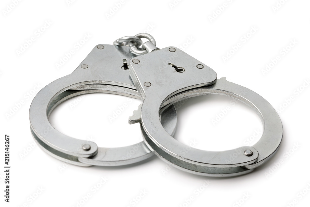 Metal handcuffs isolated on white background, close-up Metal handcuffs isolated on white background, close-up