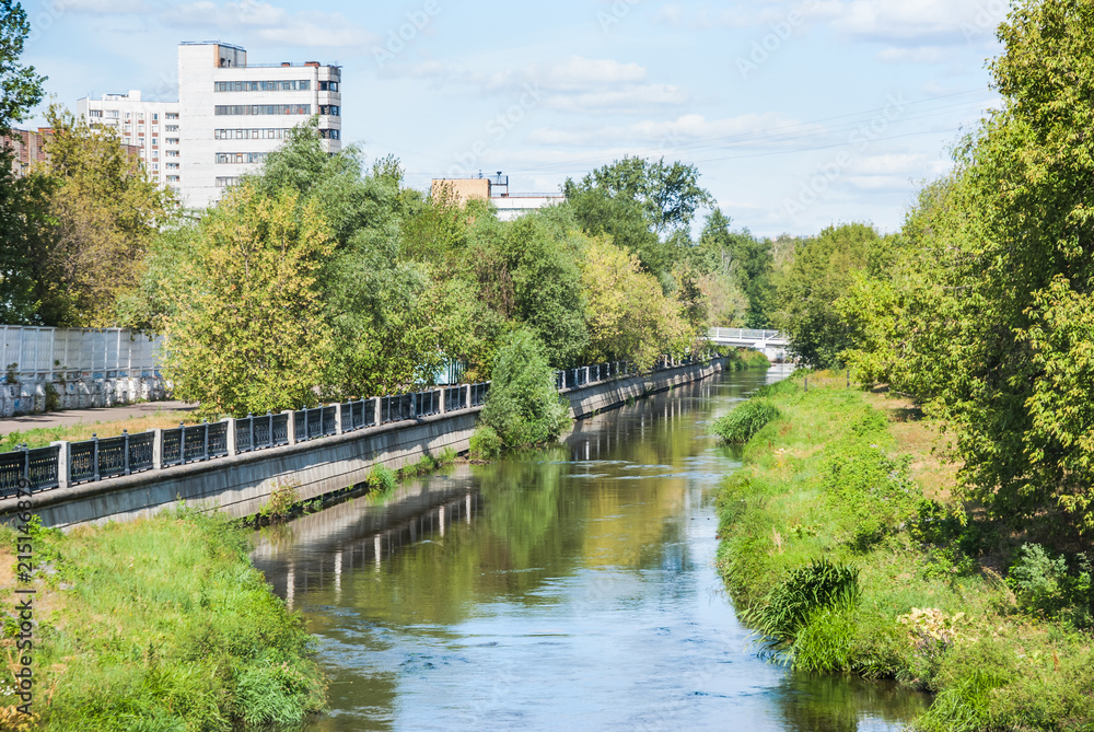 Russia, Moscow. The Yauza river in Rostokino district. A picturesque riverside, embankment Russia, Moscow. The Yauza river in Rostokino district. A picturesque riverside, embankment
