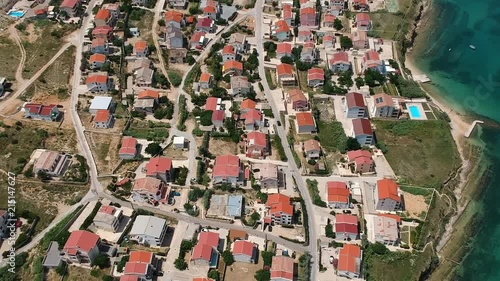 Above tourist houses and hotels near a blue sea