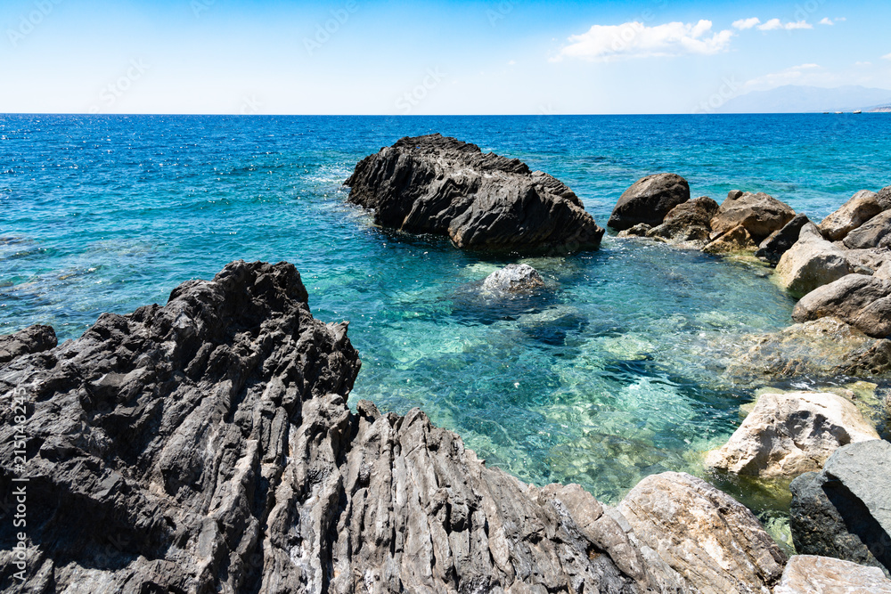 Lybian Sea compressed rock layers cut off mainland of south central Mediterranean coast of Crete, Greece. Nature and Geological science concept