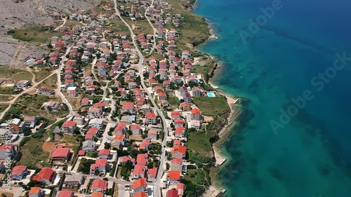 Tourist resort on the beautiful blue sea with cars on the street