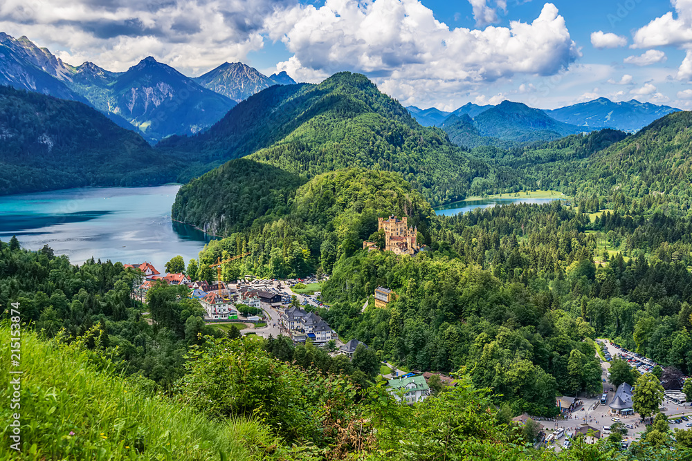 Naklejka premium Fussen, Germany- June 10, 2018: Lake Alpsee and Hohenschwangau Castle. View of Schloss Hohenschwangau, ancestral home to Bavaria’s King Ludwig II, builder of some of Germany’s most famous castles.