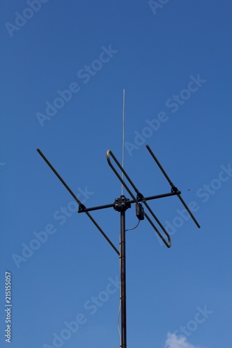 Radio broadcast tower, wireless communication antenna on blue background. © venars.original